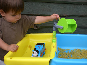 Child playing with a dry pasta table
