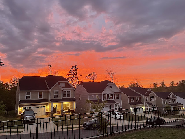 The nighttime clouds are encroaching a little bit more as the sun continues to set. The sky is less bright as before.