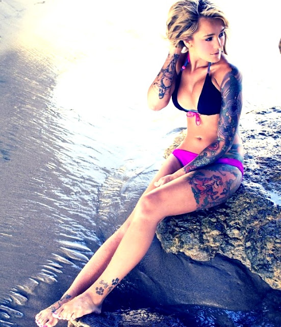 girl in bikini showing tattoos