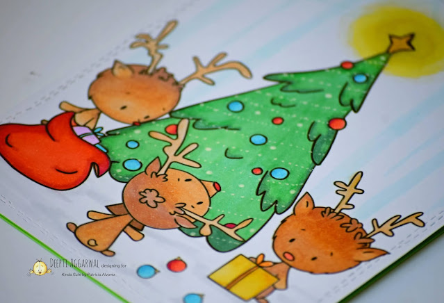 Reindeer decorating Christmas Tree card