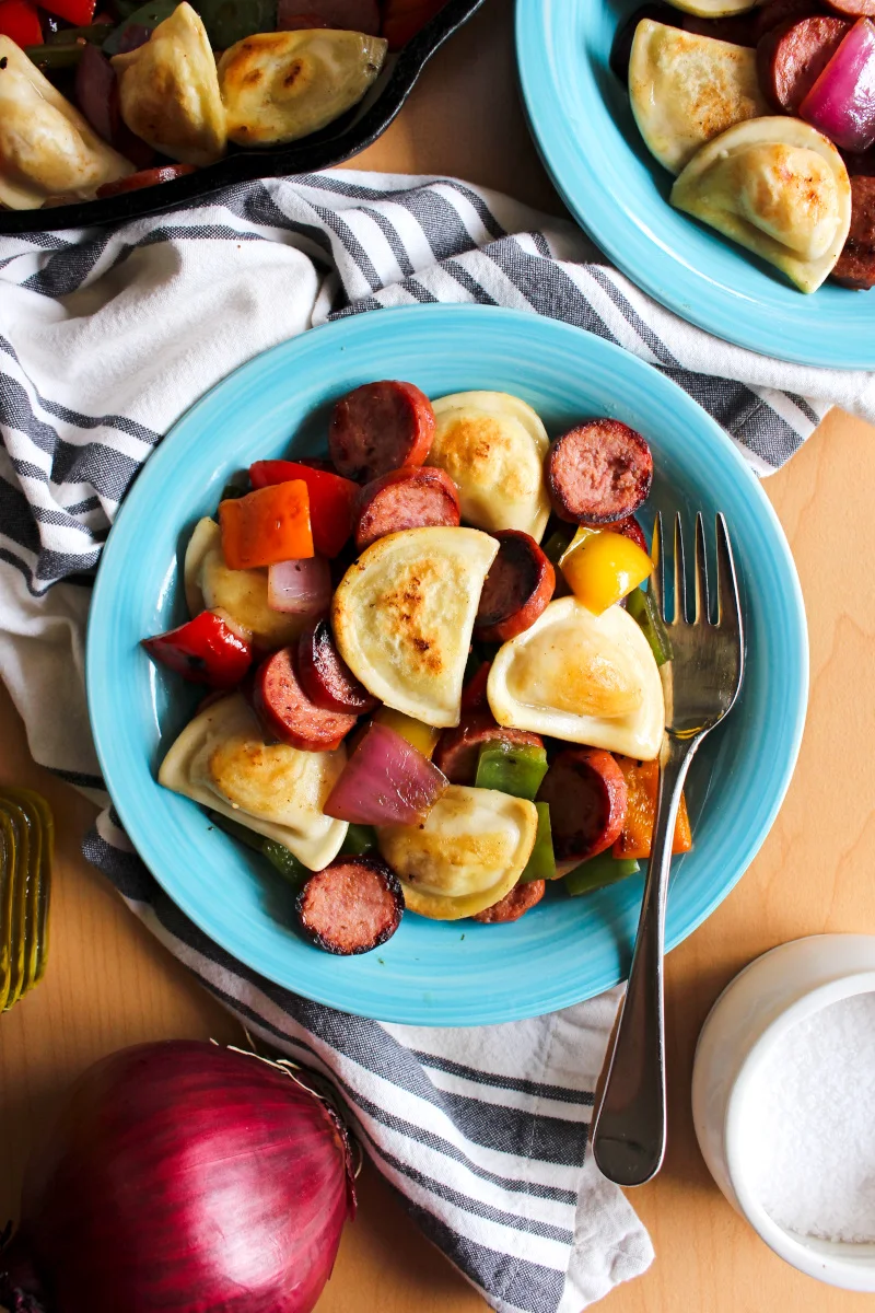 Kielbasa, Pepper, Onion, and Pierogy Hash is a simple and easy to prepare recipe that is on the table in less than 30 minutes. It's the perfect family meal for busy days!