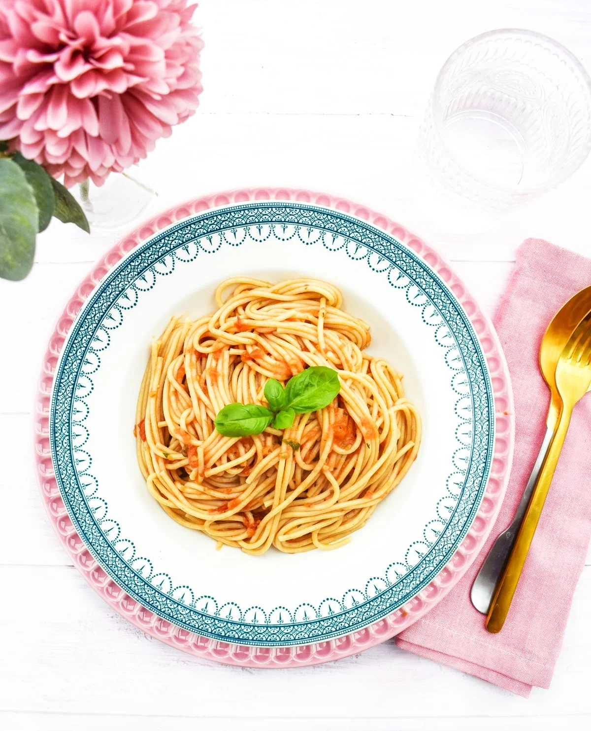 spaghetti with roast tomato sauce in a bowl.