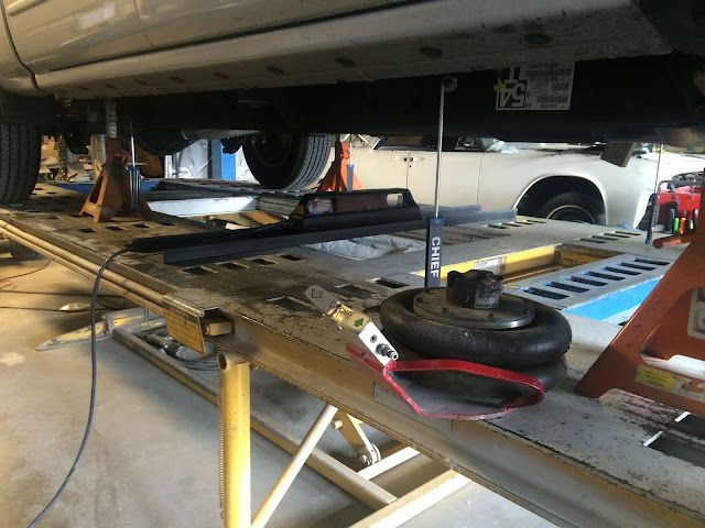 Chevy Silverado on frame machine during collision repairs at Almost Everything Auto Body