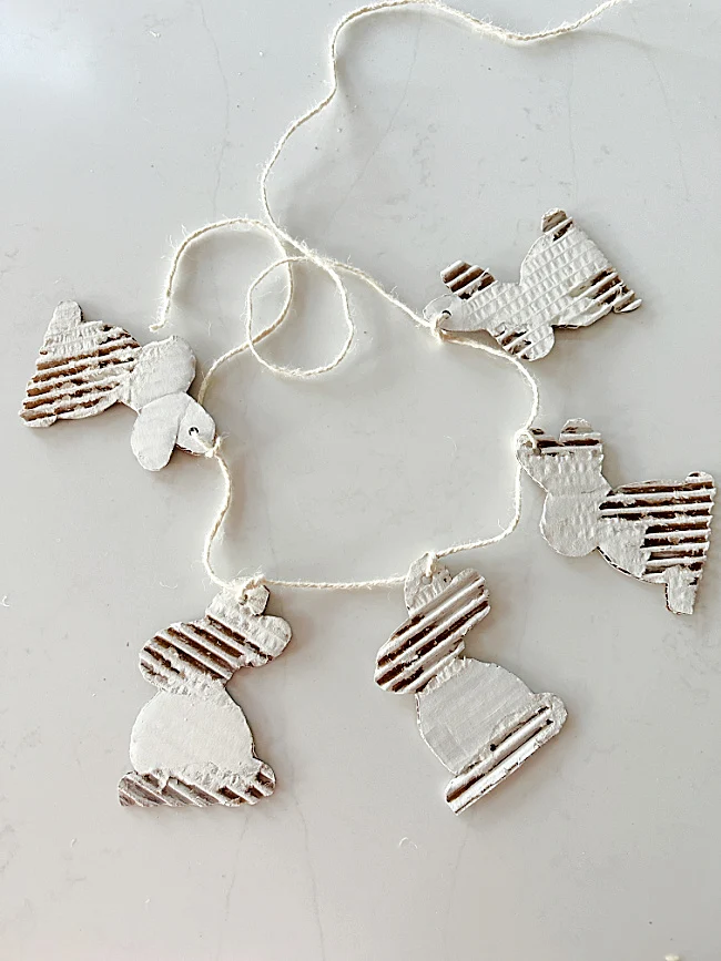 corrugated white bunnies on twine