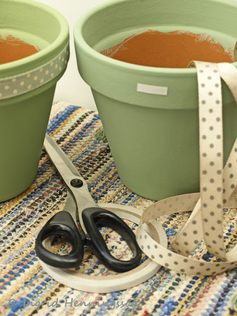 Painted terracotta pots with ribbons