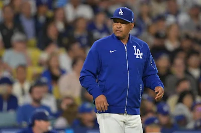 Los Angeles Dodgers manager Dave Roberts walks off the field during 2025 game.