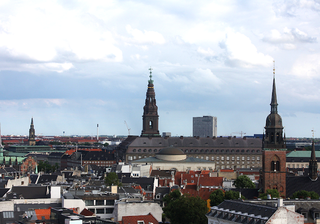 The crown spire tops Christiansborg Palace in the distance seen from the observatory deck at The Round Tower.