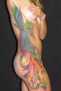 Phoenix Tattoos For Girls (this beautiful phoenix tattoo sports rainbow colors to decorate this girls body from her armpit to her thigh )