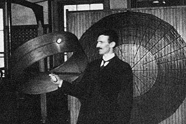 Tesla showing aus one of his many inventions.