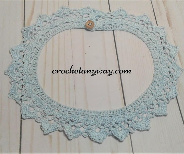 completed crochet collar with button in blue cotton crochet thread