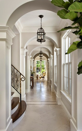 elegant foyer hallway with white wood panelling trim inlaid marble floors