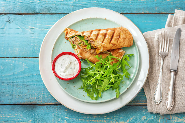 Warm Lebanese Dinner Wraps with Minted Yoghurt in a Serving Dish