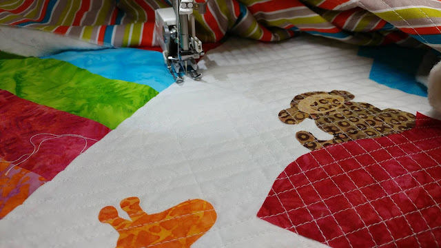 Row by Row On the Go zoo animals and train baby quilt