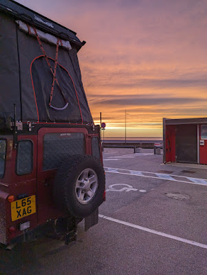 Defender at sunset in Dieppe aire de camping car