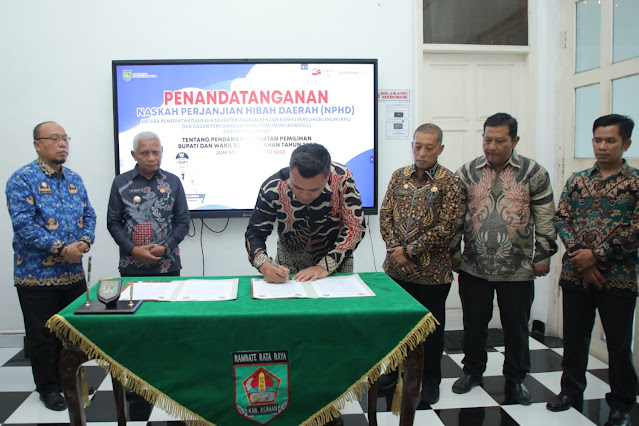 Teken NPHD bersama Ketua KPU Kabupaten Asahan, Ini Harapan Bupati Surya