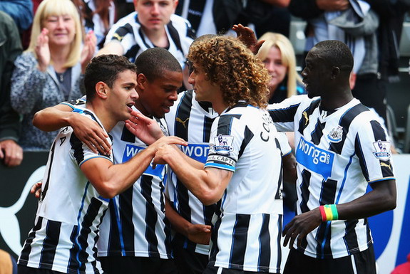 Hatem Ben Arfa celebrates with Newcastle teammates after scoring the winning goal against Fulham