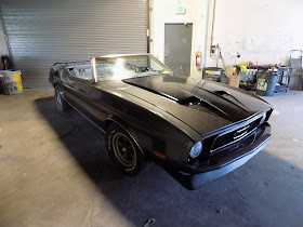 1973 Mustang with new front end, complete paint job & rally strips.