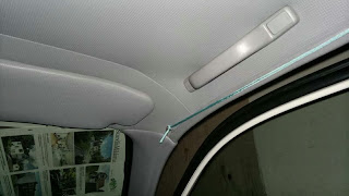 I added small paperclips to the headliner, and then attached some paracord string.