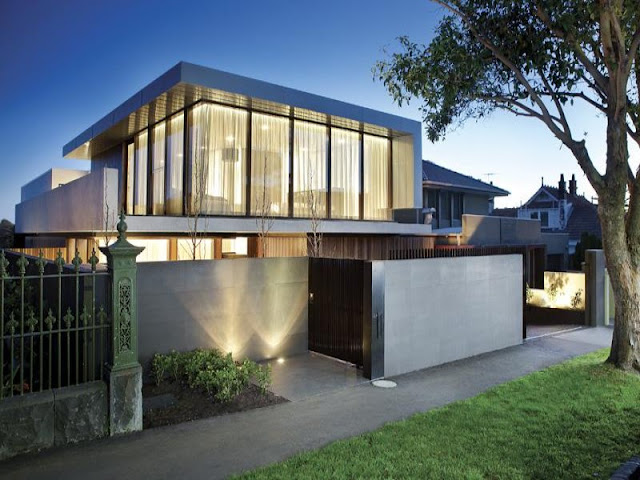 Photo of amazing dream home at sunset as seen from the street