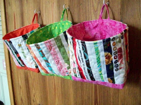 fabric buckets hanging on the wall
