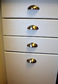 nickel plated cup pulls on white drawer