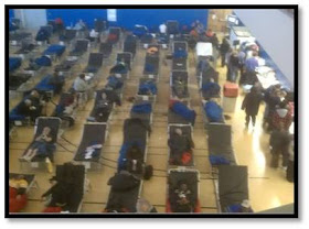 A gymnasium at Lehman College serves as a makeshift shelter for displaced residents