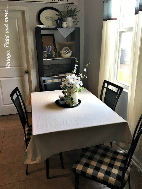 Vintage Paint and more... an awesome makeover done to a thrift store table and chairs with just some black chalkboard paint and some black and cream buffalo plaid fabric