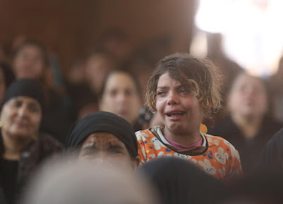 From the mass-funeral of the victims by Nader Nabil