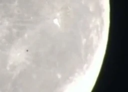 UFO passing the Moon caught on camera.