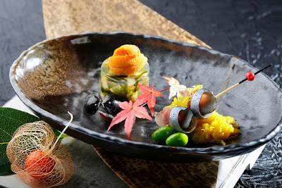 Source: InterContinental Hong Kong. Steamed awabi, uni shijimi dashi jelly and shime saba sashimi kiku dressing.