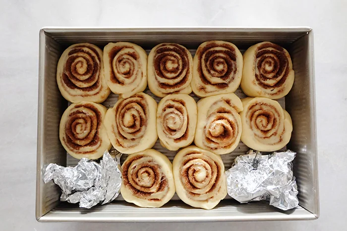cinnamon rolls rested in pan before baking