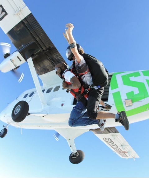 Singer, Banky W 'Dabs' in the Sky as He Jumps Off a Helicopter During Skydiving in Dubai (Photos)