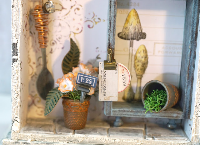 ASW | Tim Holtz Shrine: Shabby Chic Potting Shed Miniature with Speckled Egg and Field Notes details.