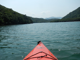 Kayak on the river with mountains framing