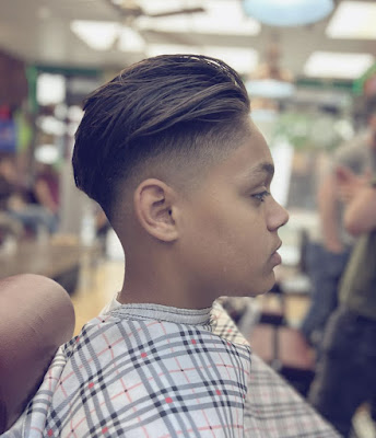 Comb over pomp with high bald fade