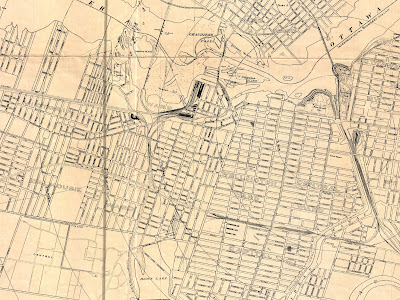 Cropped map of Ottawa, with extents Hintonburg (West), Ottawa River and bits of Hull Island (North), King Edward Avenue (East) and most of the Glebe and Central Experimental Farm (South). Streets and railroad tracks are drawn and labelled, no buildings. Concentric circles are drawn emanating from near Elgin and Wellington (on the right side of the map) spaced 1/2 a mile apart, the furthest being 2 1/2 miles on the left side of the map around the west end of Hintonburg.