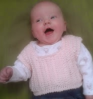 http://www.ravelry.com/patterns/library/vinca-sweater-vest---sizes-newborn-to-3-years