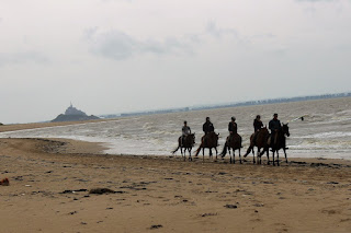 Cavaliers sur la plage