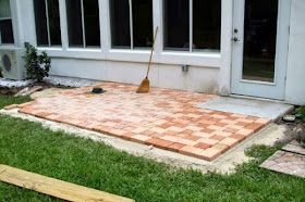 finishing the stone pattern placement for how to create a patio with stone pavers 