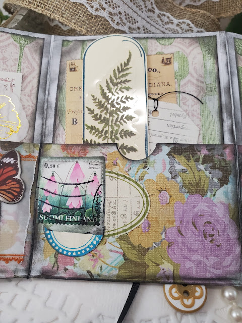 Ephemera folder pocket with stamped terrarium image and fern sticker.