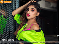 hot pic yashika aannand in pink bra, parrot green top and standing by net cage