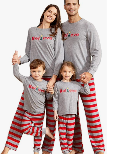 family wearing matching christmas pajamas with the words Believe on them