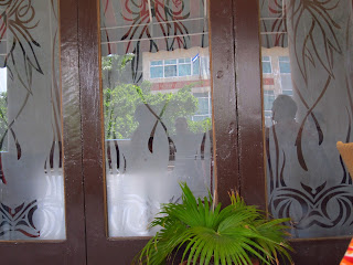 Santiago de Cuba Hotel Casa Granda glass doors on veranda 