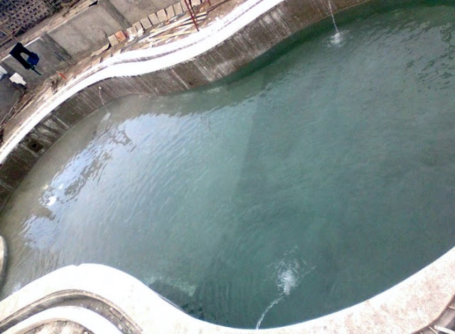 Filling up the swimming pool with natural hot spring water