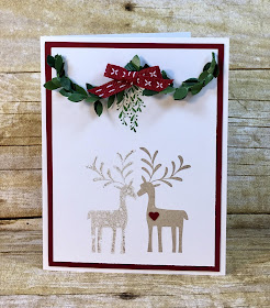 This Christmas card uses Stampin' Up!'s Merry Mistletoe stamp set along with the Boxwood Wreaths and the Cherry Cobbler 1/4" Double Stitched Ribbon.  It uses the reflection technique so the deer are kissing.  Instructions and reflection vidoe on the blog!  #stamptherapist #stampinup www.stamptherapist.com