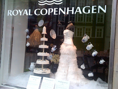 The pretty wedding dress cake and display of china really play into that The pretty wedding dress cake and display of china really play into that