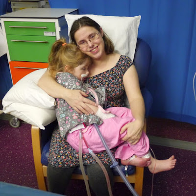 Jessica her first post-surgery cuddle with Mummy