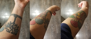 A series of three images showing different sides of a tattoo showing a tree next to a family of 6 colorful monsters. The tattoo is on the forearm of Haley McAndrews.