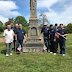 Placing flags at the graves of our departed brothers