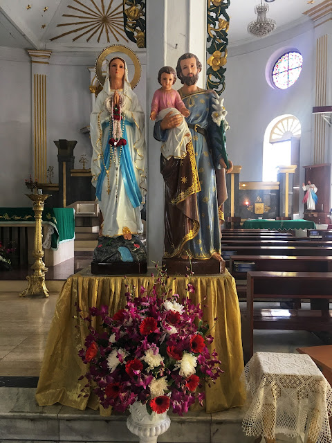 statues of the holy family at catholic church bangkok thailand